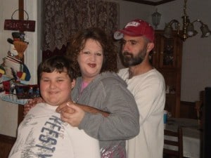 Gene and I with my oldest son (and baby on the way) during our first Christmas together. 